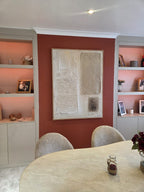 Modern minimalist rustic Japandi canvas painting styled above a neutral fabric sofa in a luxury living room