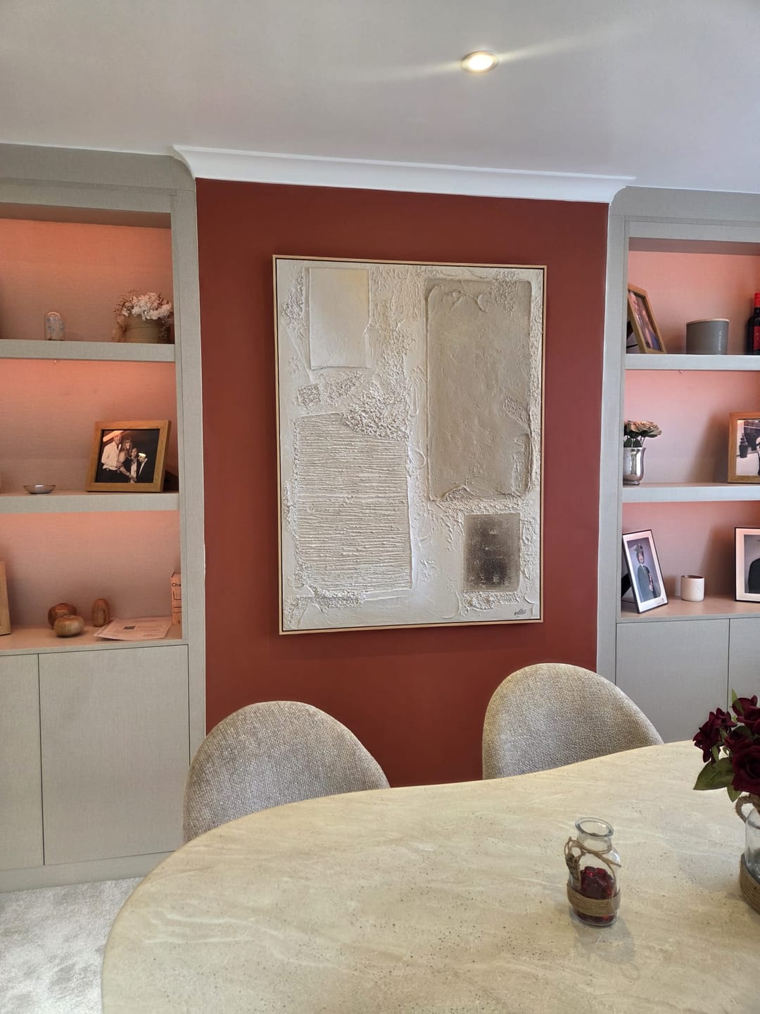 Modern minimalist rustic Japandi canvas painting styled above a neutral fabric sofa in a luxury living room