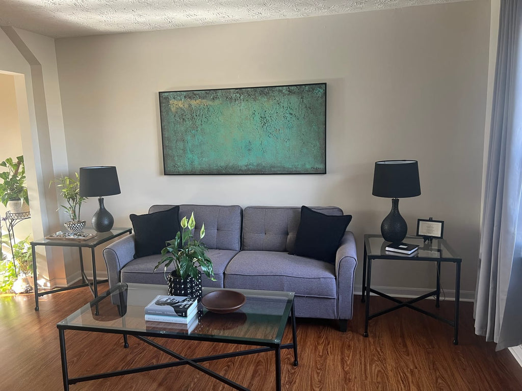 Contemporary minimalist emerald green art piece enhancing a sleek, neutral toned dining room gallery wall.