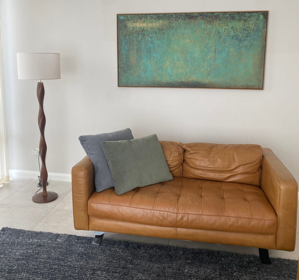 Sophisticated heavy textured panoramic green artwork adding deep inspiration and organic design to a home office.