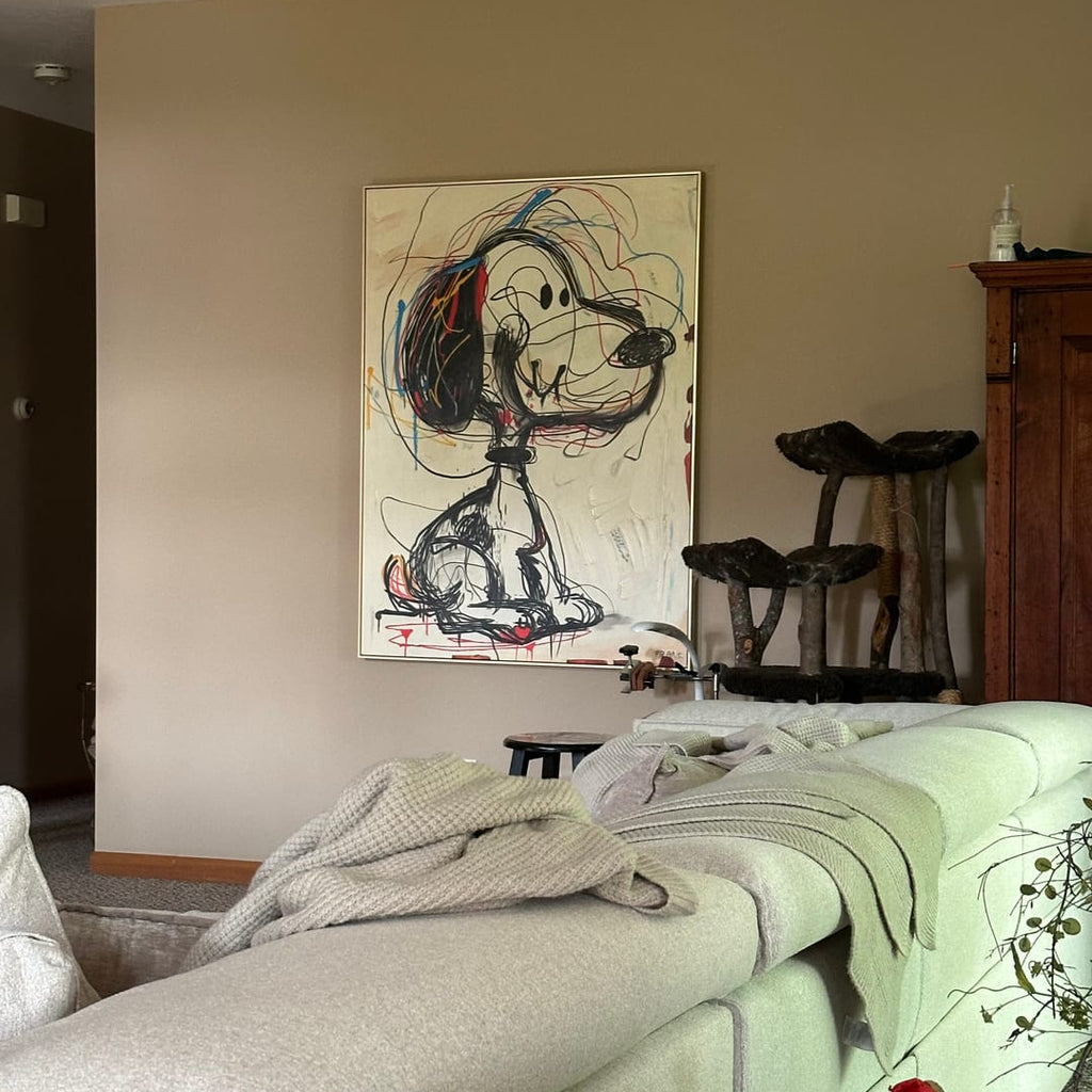 Abstract puppy graffiti-style textured wall art, hung on the living room wall.
