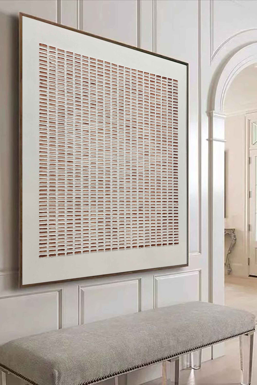 Large minimalist neutral geometric canvas artwork beautifully framed and hung above a living room sofa.