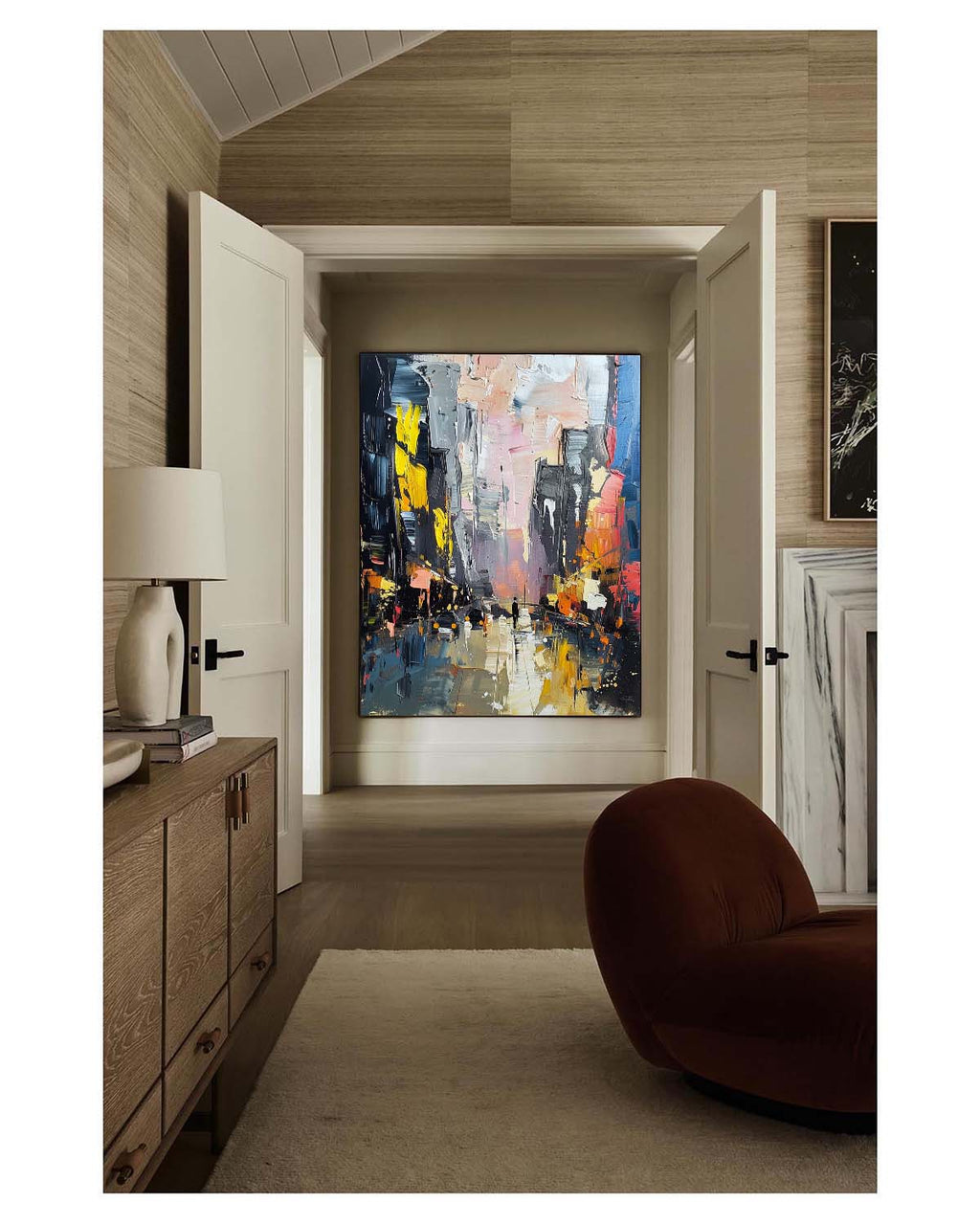Avenue multi-colored heavy texture plaster relief painting beautifully displayed in an upscale dining space near the table