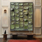 Modern organic sage green heavy texture painting creating a calm nature inspired aesthetic over a bedroom bed.