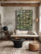 Contemporary textured plant motif art piece enhancing the gallery wall of a sleek dining room area.