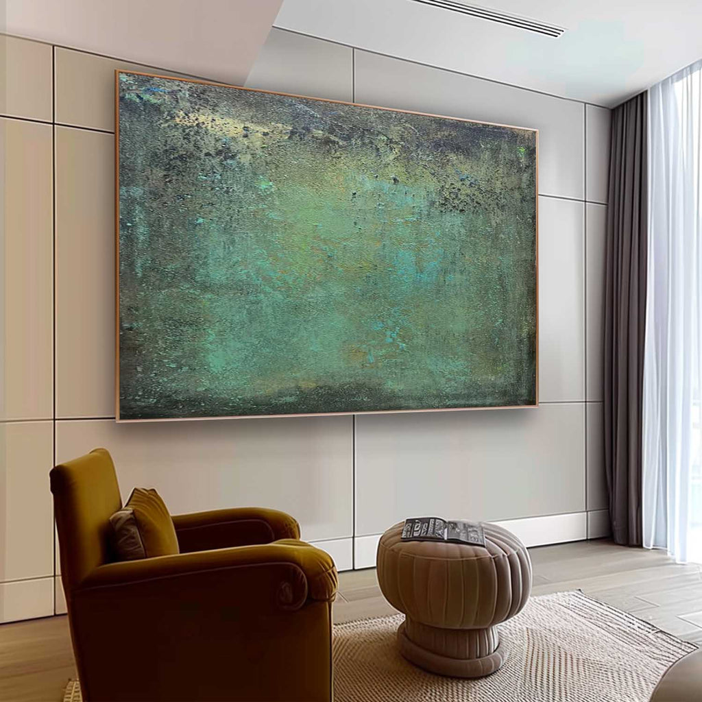 Modern deep green heavy texture distressed painting creating a calm nature inspired aesthetic over a bedroom bed.