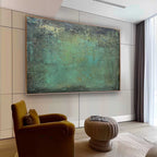 Modern deep green heavy texture distressed painting creating a calm nature inspired aesthetic over a bedroom bed.