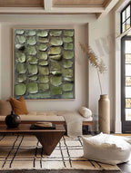 Sophisticated heavy textured abstract foliage artwork adding biophilic design and cozy style to a home office.