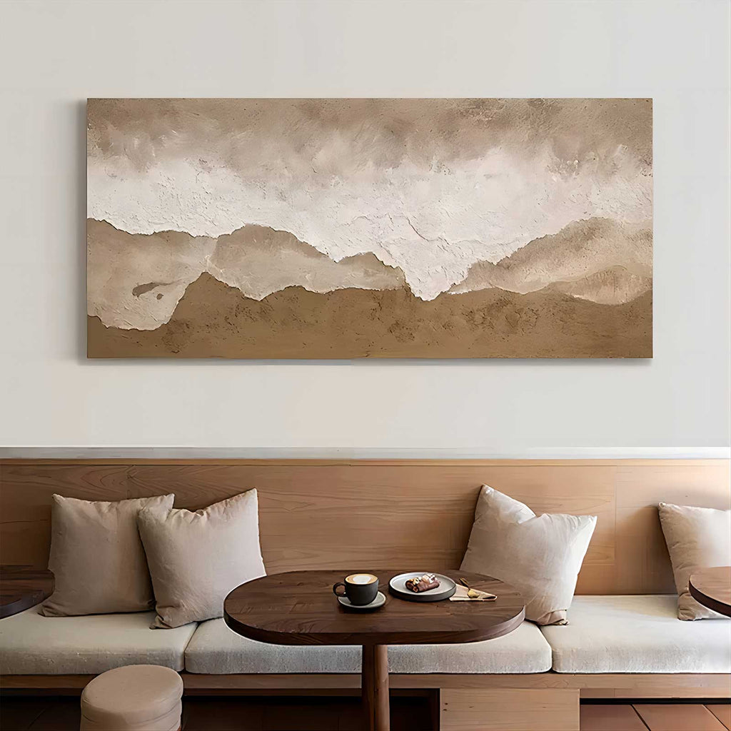 Modern beige and brown heavy texture sea wave painting creating a serene aesthetic over a master bedroom bed.