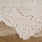 Close-up macro shot showing detailed 3D plaster wave crests and thick textured earth layers of Parge Art canvas.